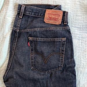 Levi’s 557 relaxed boot cut jeans.